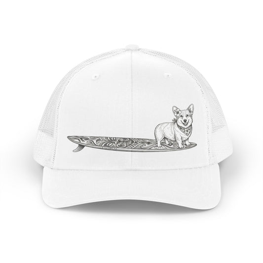 White trucker hat with Corgi in hibiscus bandana and hibiscus ear flower on a tiki surfboard illustration — The Swell Dogs