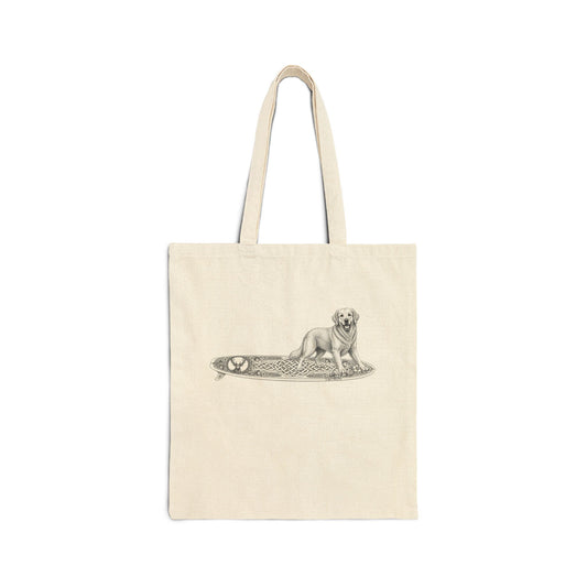 Beige tote bag with a Golden Retriever riding a long surfboard with keltic knots and embellishments.