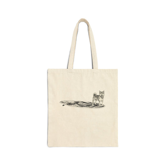 Natural canvas tote bag with Shiba Inu surfboard illustration, rising wave and Japanese sun flag design in vintage black line art — The Swell Dogs