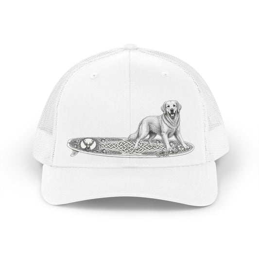 White trucker hat with a white Golden Retriever dog on a surfboard with a irish knot graphic on it.