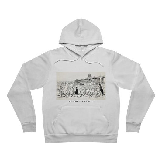 White hoodie with graphic design of 9 dogs facing the surf south of the Huntington Beach pier waiting for a swell.