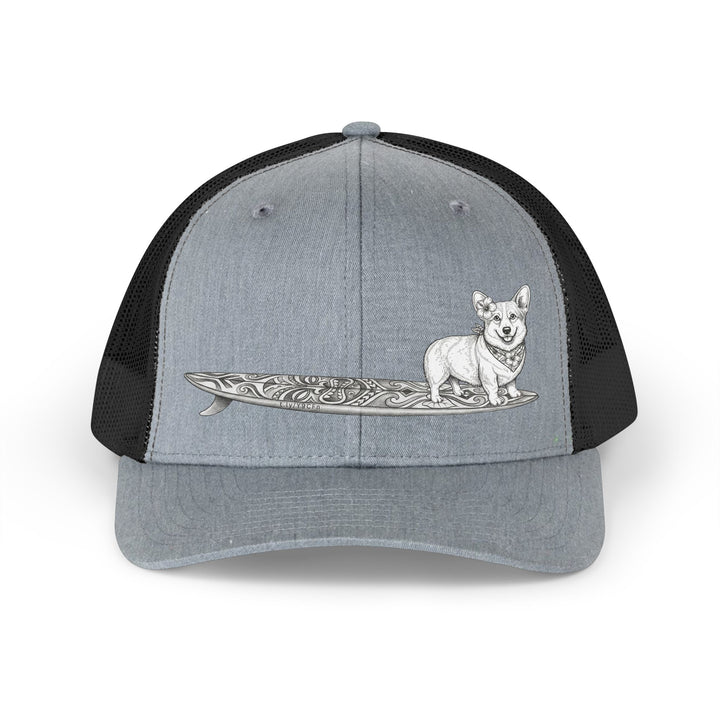 Gray and black trucker hat with vintage Corgi wearing hibiscus bandana and hibiscus in her ear on a tiki surfboard — The Swell Dogs