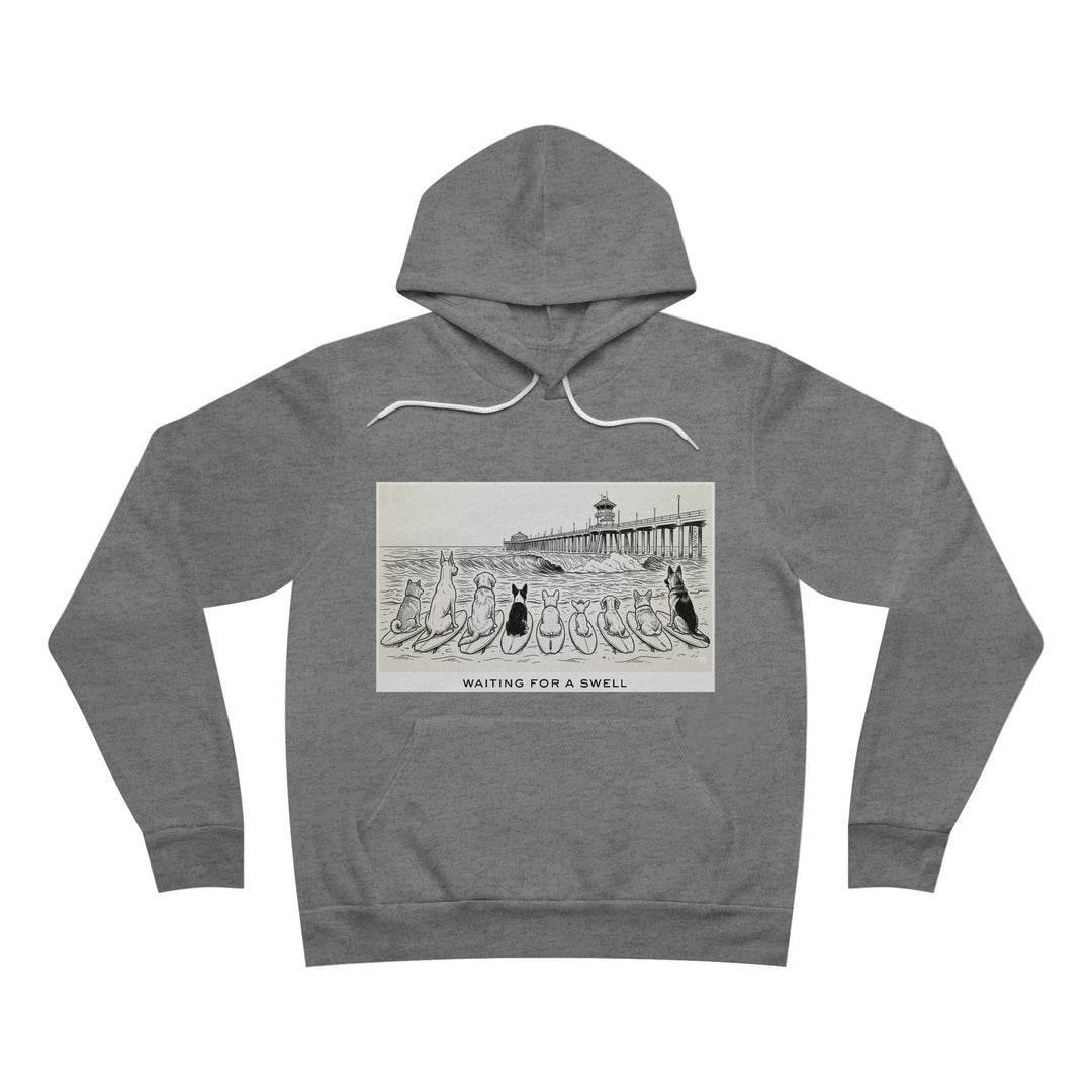 Gray hoodie with graphic design of 9 dogs facing the surf south of the Huntington Beach pier waiting for a swell.
