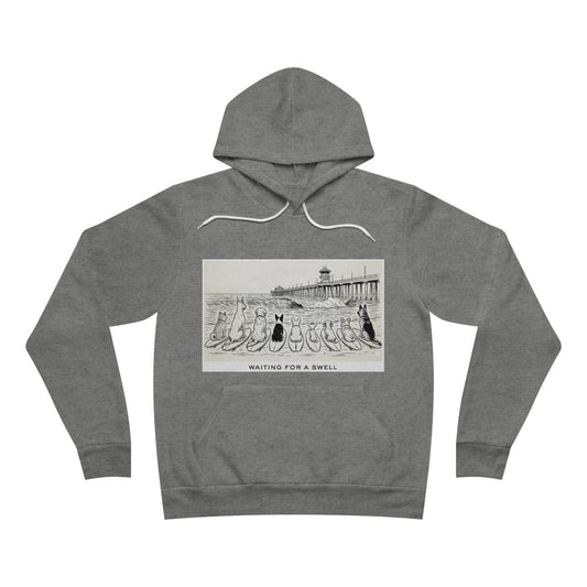 Gray hoodie with graphic design of 9 dogs facing the surf south of the Huntington Beach pier waiting for a swell.