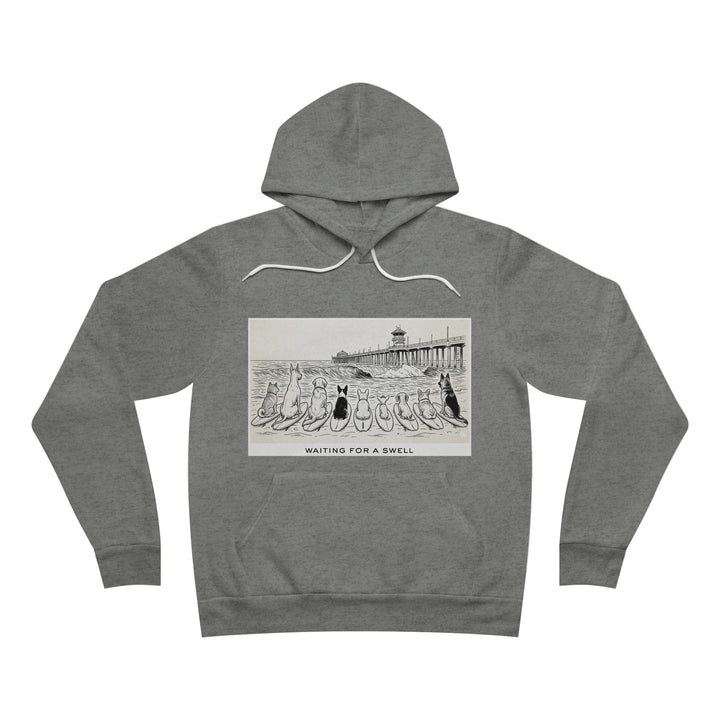 Gray hoodie with graphic design of 9 dogs facing the surf south of the Huntington Beach pier waiting for a swell.