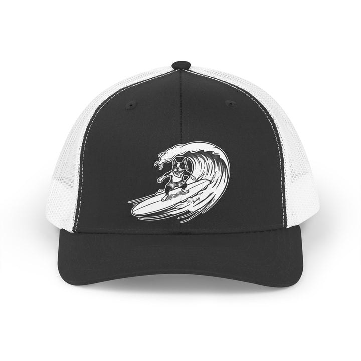 Black and white trucker hat with a black and white graphic of a Boston Terrier surfing on a big wave with a black background.