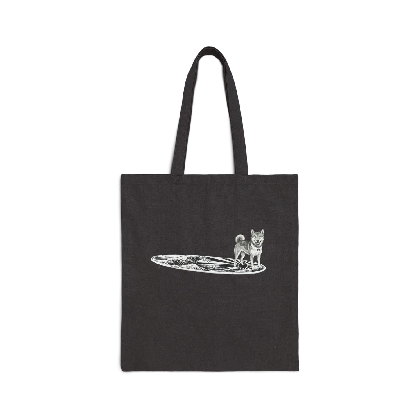Black canvas tote bag with vintage Shiba Inu on a surfboard featuring rising wave and Japanese sun flag line drawing — The Swell Dogs