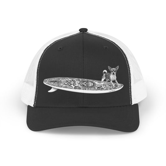 Black and white trucker hat with a Chihuahua surfing on a Day of the Dead surfboard. 