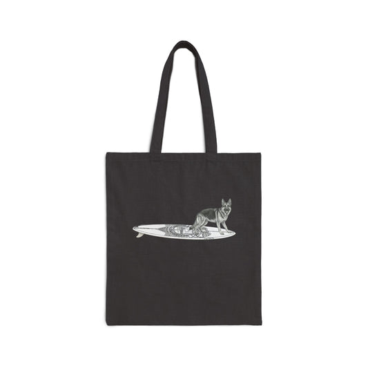 Black tote bag with a German Shepherd dog on a surfboard designed  with a service badge on it.