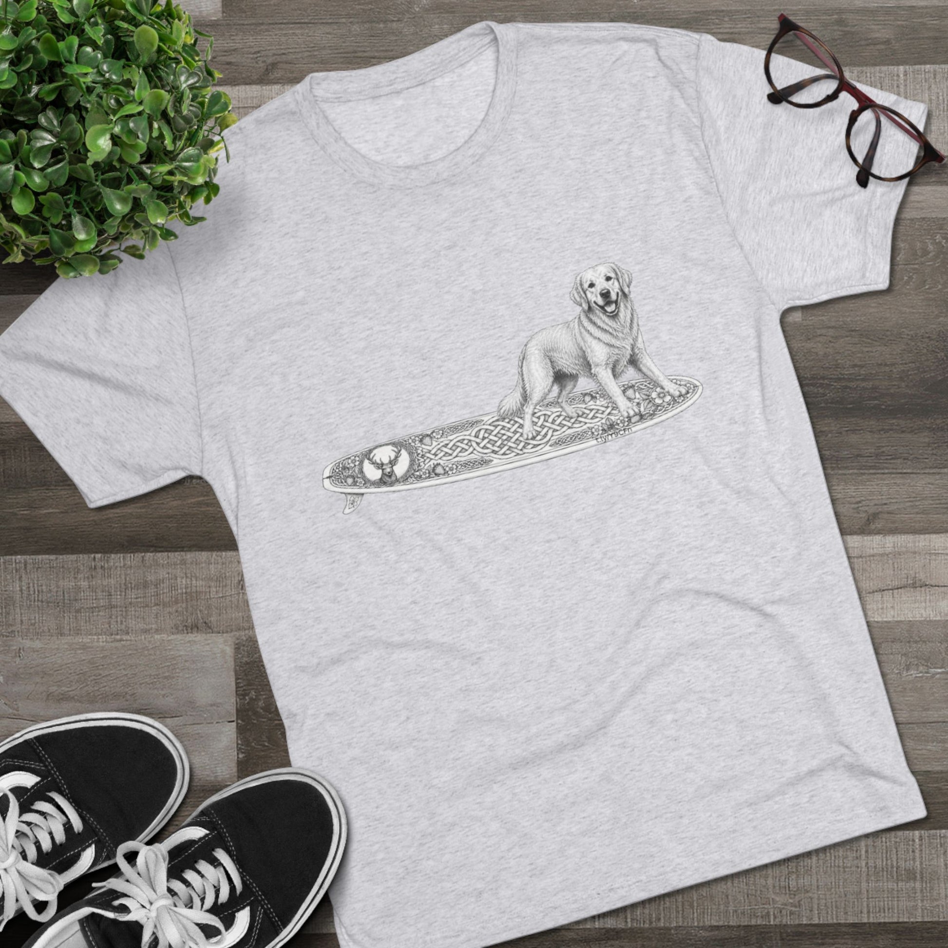 Gray t-shirt with a Golden Retriever riding a long surfboard with keltic knots and embellishments.