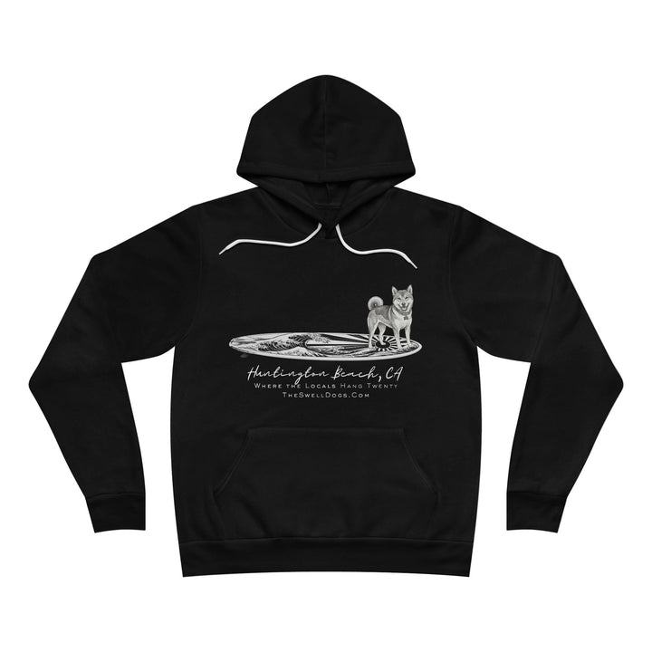 Black pullover hoodie featuring a Shiba Inu dog standing on a Japanese surfboard with "Huntington Beach, CA" text