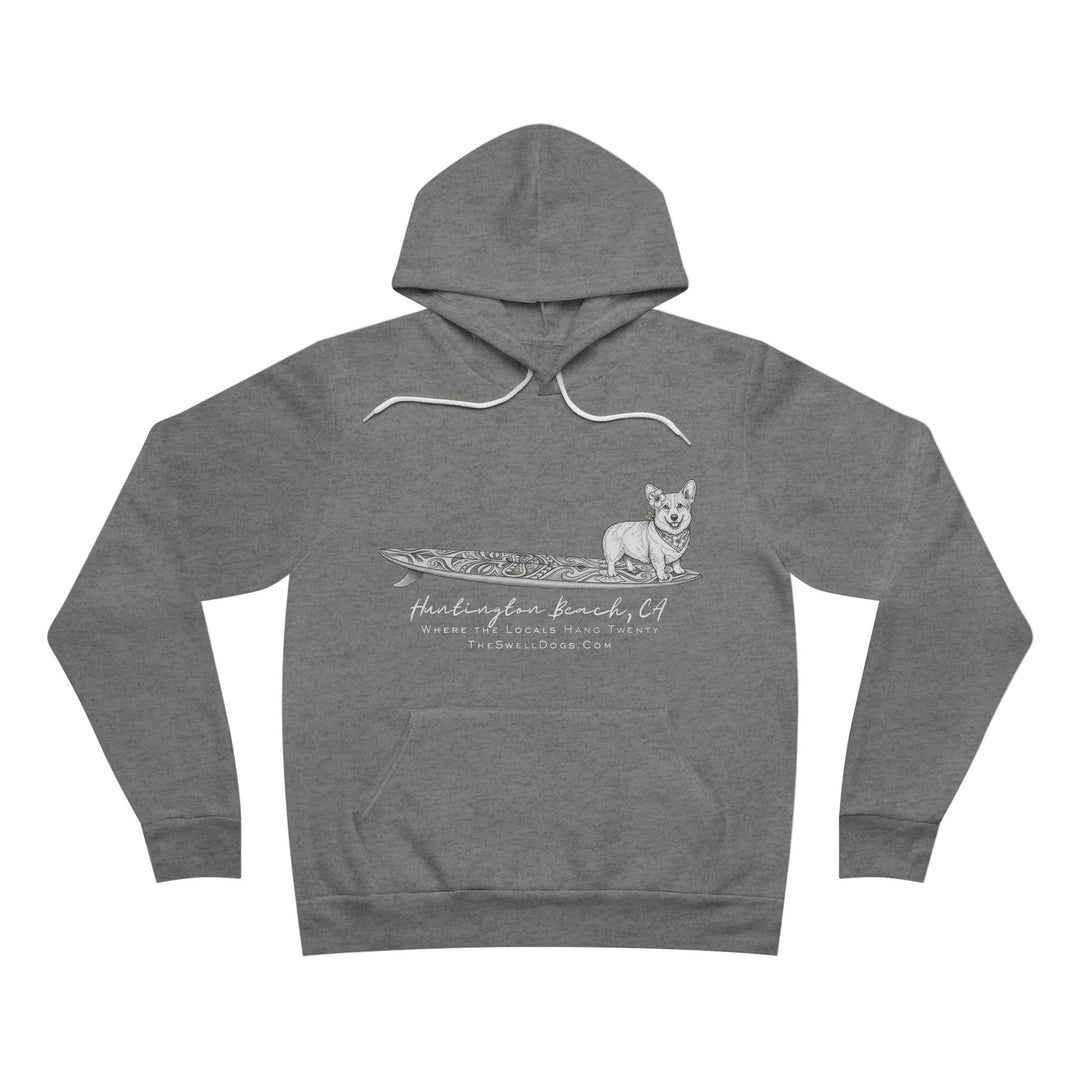 Grey pullover hoodie featuring a Corgi dog standing on a tiki surfboard with "Huntington Beach, CA" text