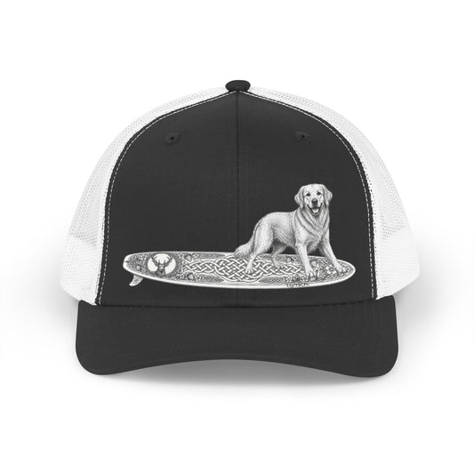 Black and white trucker hat with a white Golden Retriever dog on a surfboard with a irish knot graphic on it.