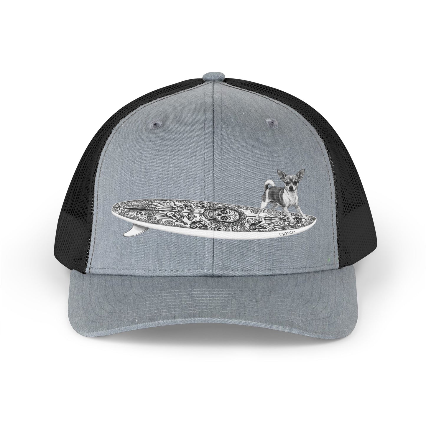 Gray and black trucker hat with a Chihuahua surfing on a Day of the Dead surfboard. 