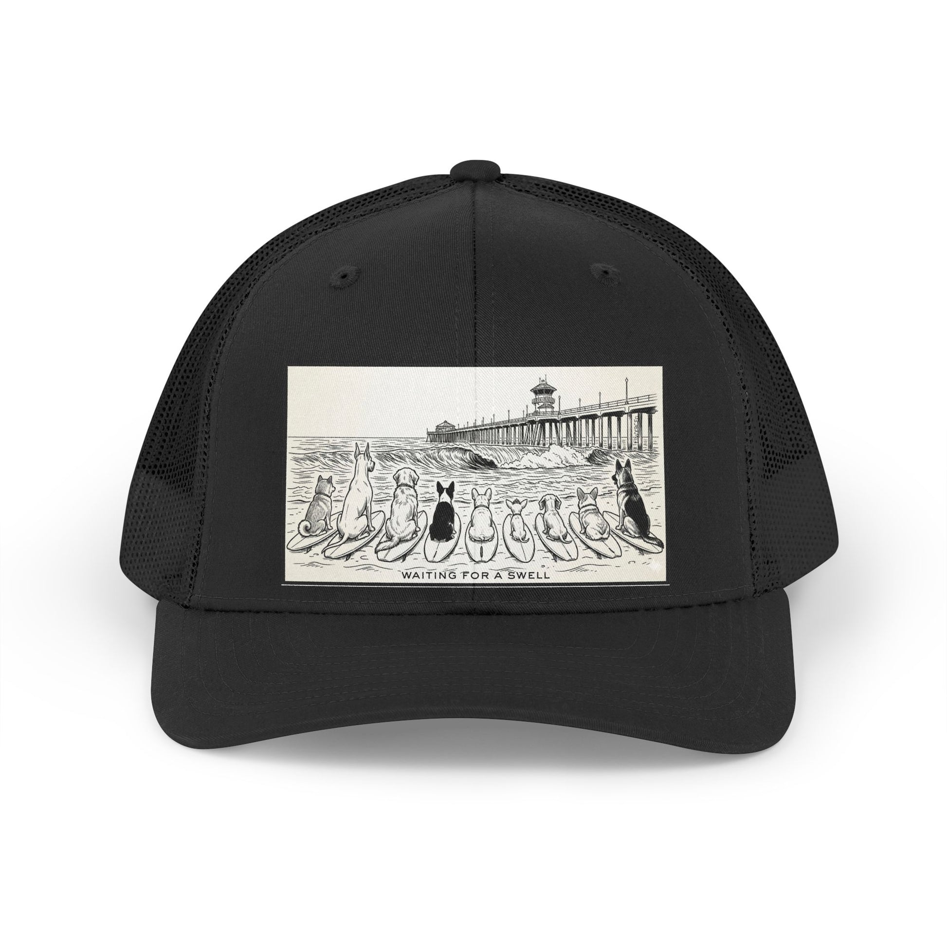 Black trucker hat with a picture of a pack of nine dogs sitting on their surfboards, facing the ocean, with the Huntington Beach pier in the background. It says Waiting for a Swell at the bottom.