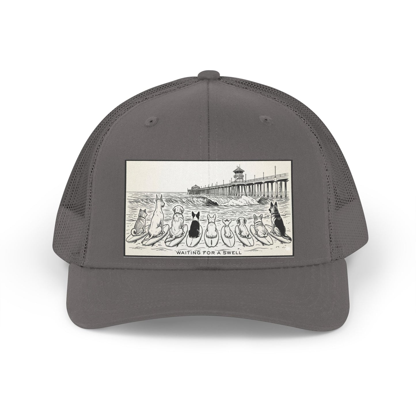 Gray trucker hat with a picture of a pack of nine dogs sitting on their surfboards, facing the ocean, with the Huntington Beach pier in the background. It says Waiting for a Swell at the bottom.