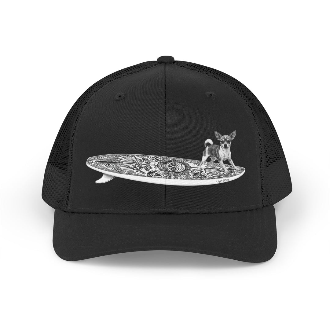 Black trucker hat with a Chihuahua surfing on a Day of the Dead surfboard. 