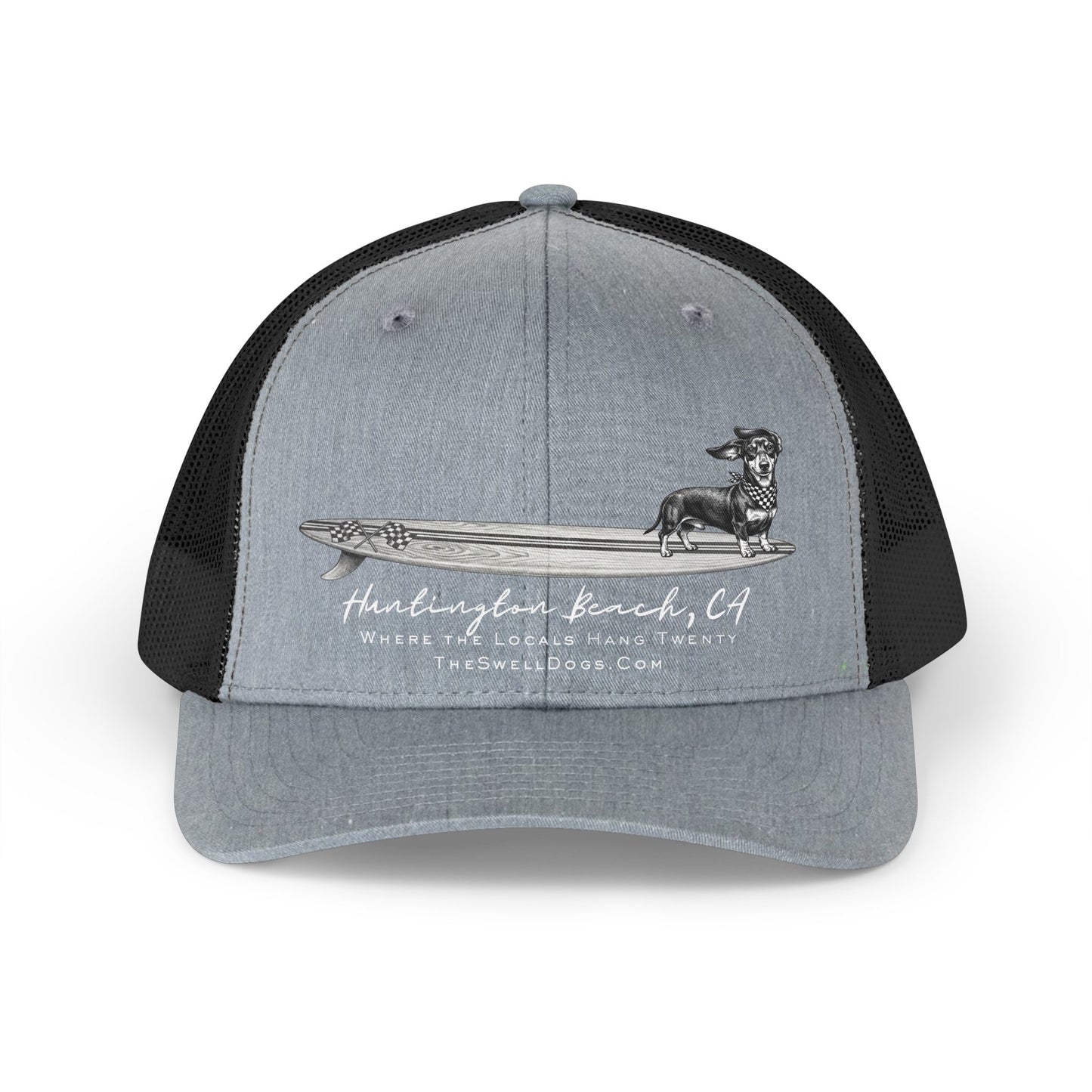 Grey and black trucker hat featuring a Dachshund dog standing on a surfboard with "Huntington Beach, CA" text