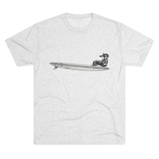 T-shirt with a graphic of a Dachshund dog on a racing flags surfboard with a racing checkered bandana on it's neck.