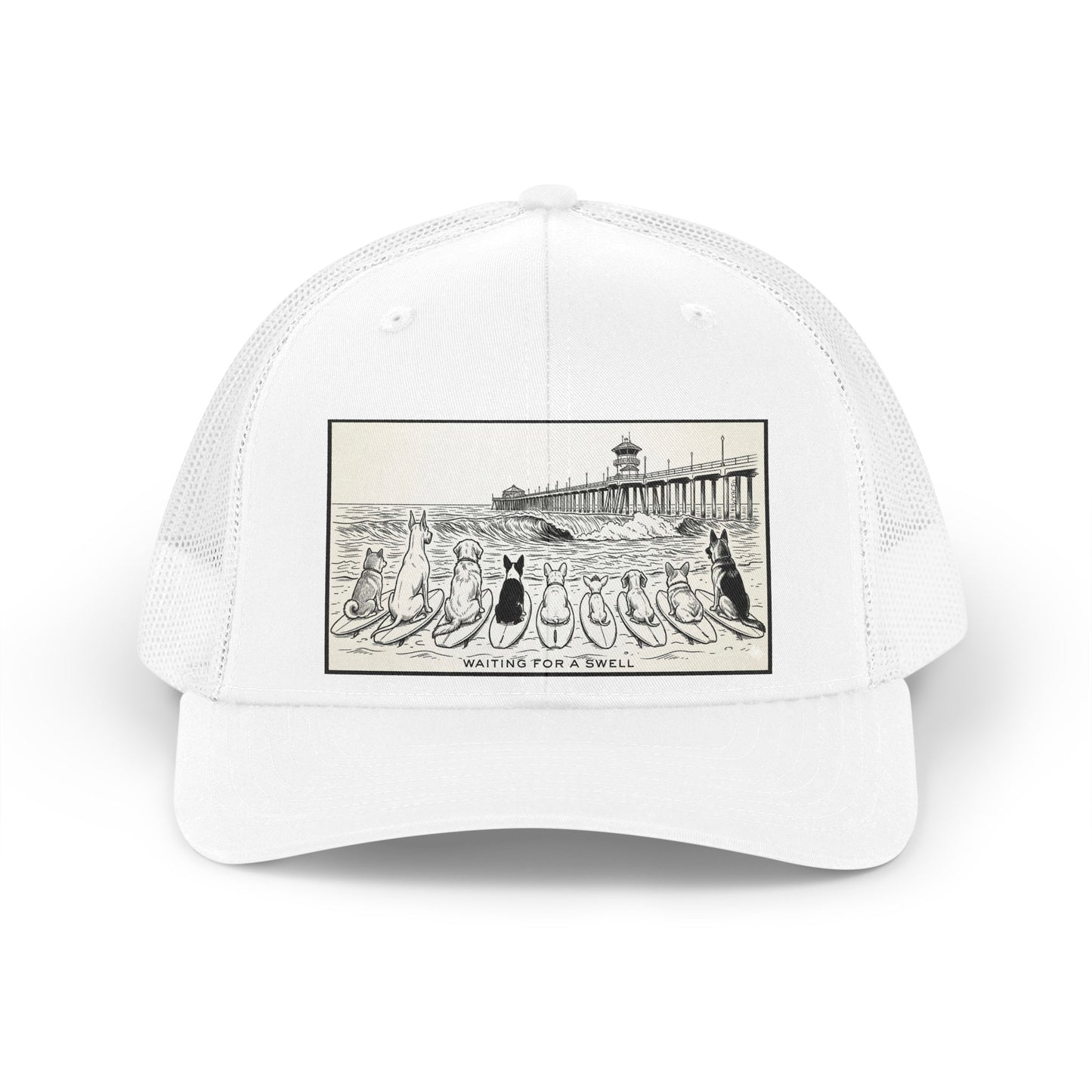 White trucker hat with a picture of a pack of nine dogs sitting on their surfboards, facing the ocean, with the Huntington Beach pier in the background. It says Waiting for a Swell at the bottom.