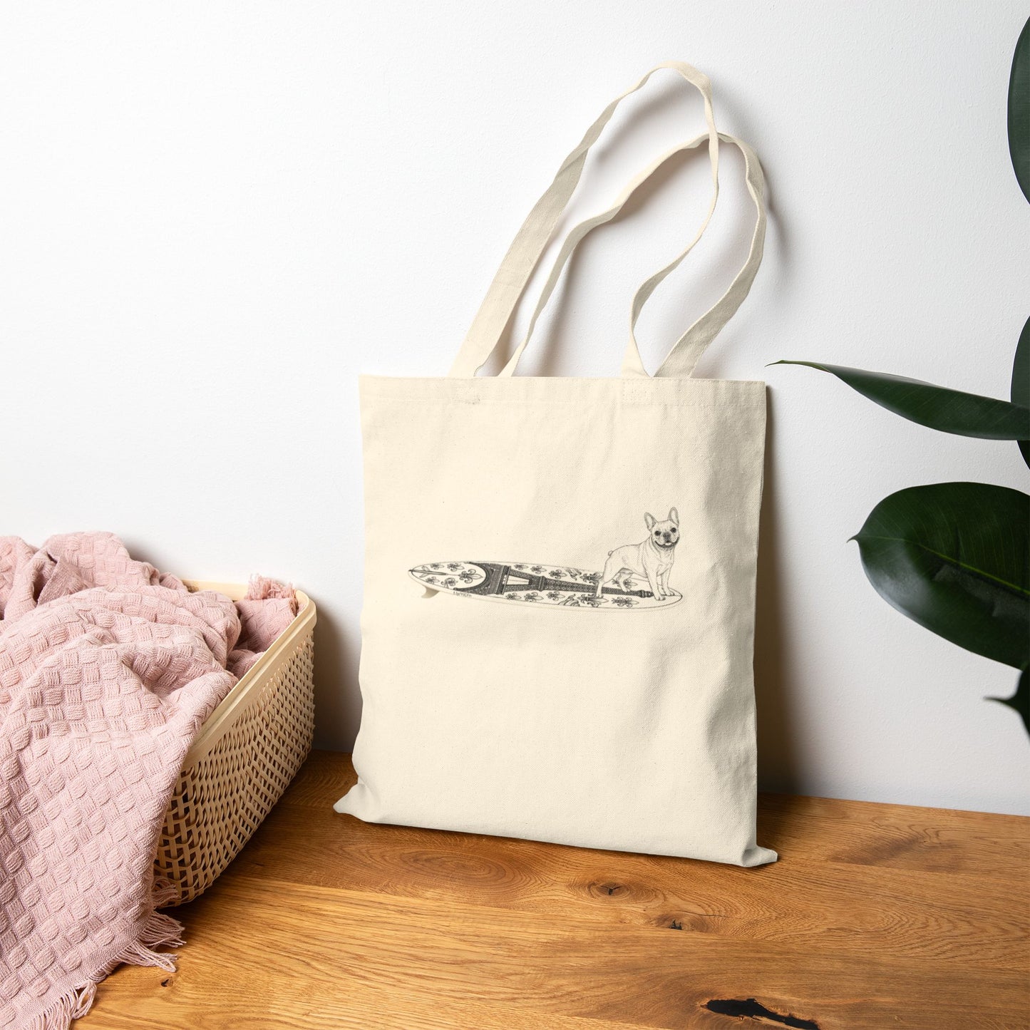Beige tote bag with a French Bulldog on an Eiffel Tower surfboard.