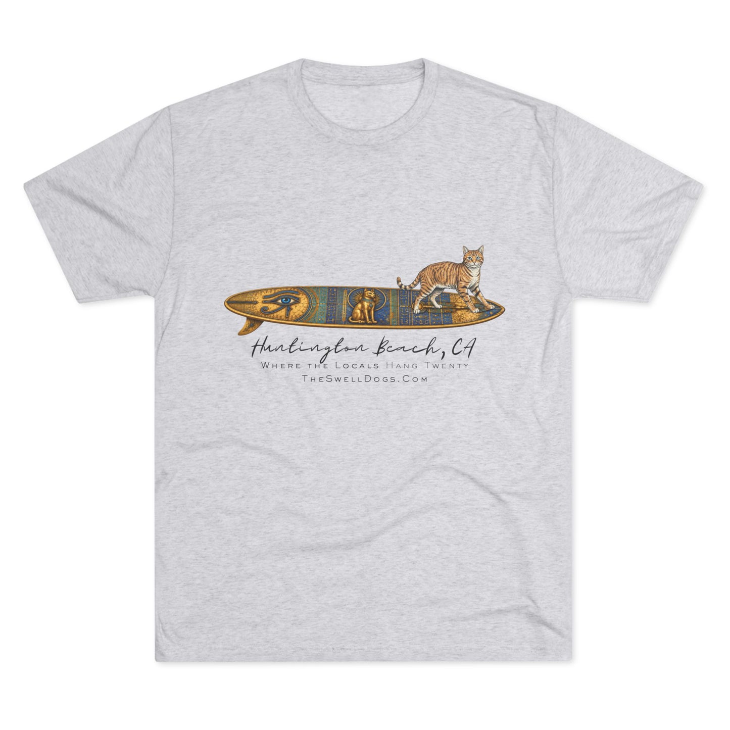 White t-shirt featuring a tabby cat standing on an Egyptian surfboard with "Huntington Beach, CA" text