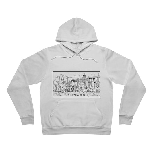 White hoodie with 9 dogs standing in front of surfboards with the Huntington Beach pier on the background.