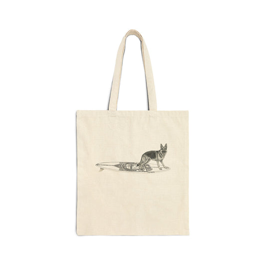 Beige tote bag with a German Shepherd dog on a surfboard designed  with a service badge on it.