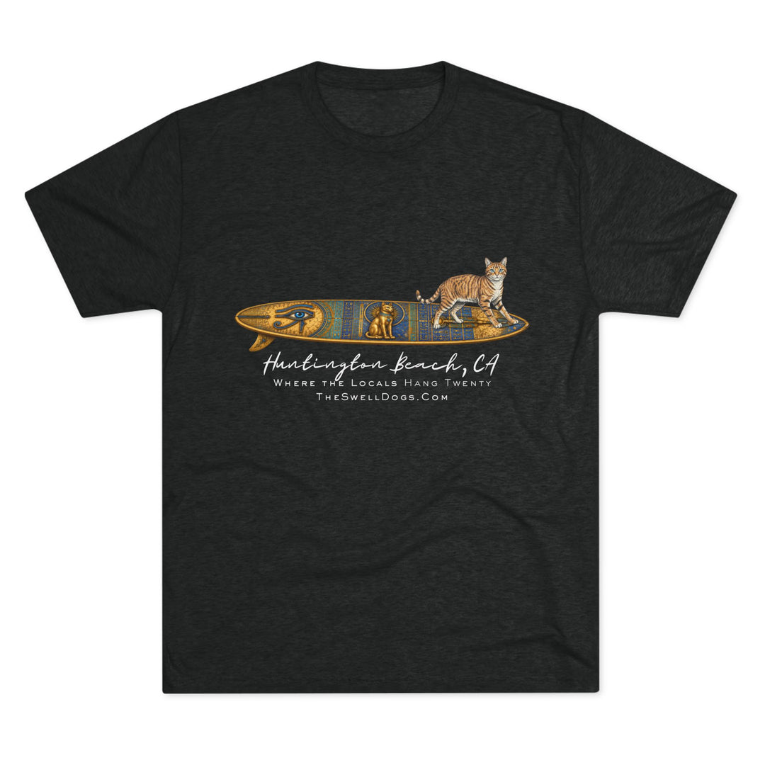Black t-shirt featuring a tabby cat standing on an Egyptian surfboard with "Huntington Beach, CA" text