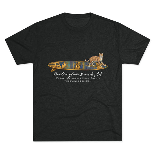 Black t-shirt featuring a tabby cat standing on an Egyptian surfboard with "Huntington Beach, CA" text