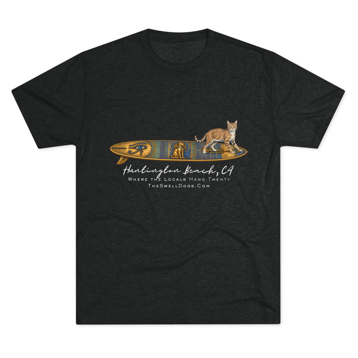 Black t-shirt featuring a tabby cat standing on an Egyptian surfboard with "Huntington Beach, CA" text