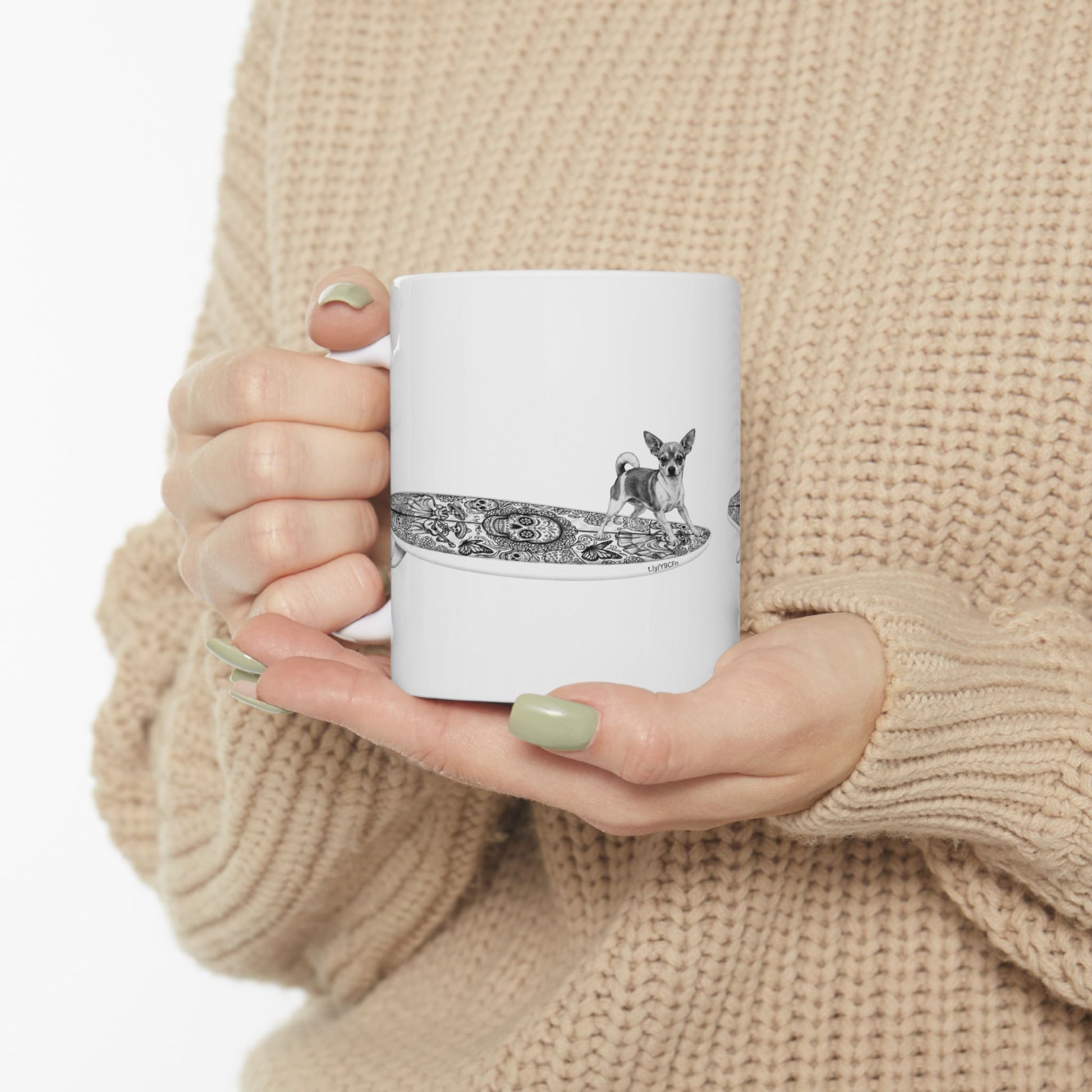 White mug with a Chihuahua surfing on a Day of the Dead surfboard.