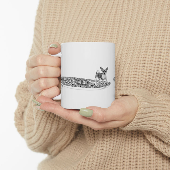 White mug with a Chihuahua surfing on a Day of the Dead surfboard.