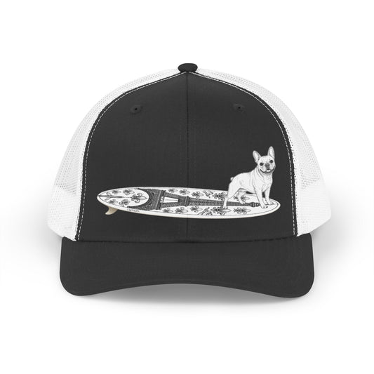 Black and white trucker hat with a French Bulldog on an Eiffel Tower surfboard.