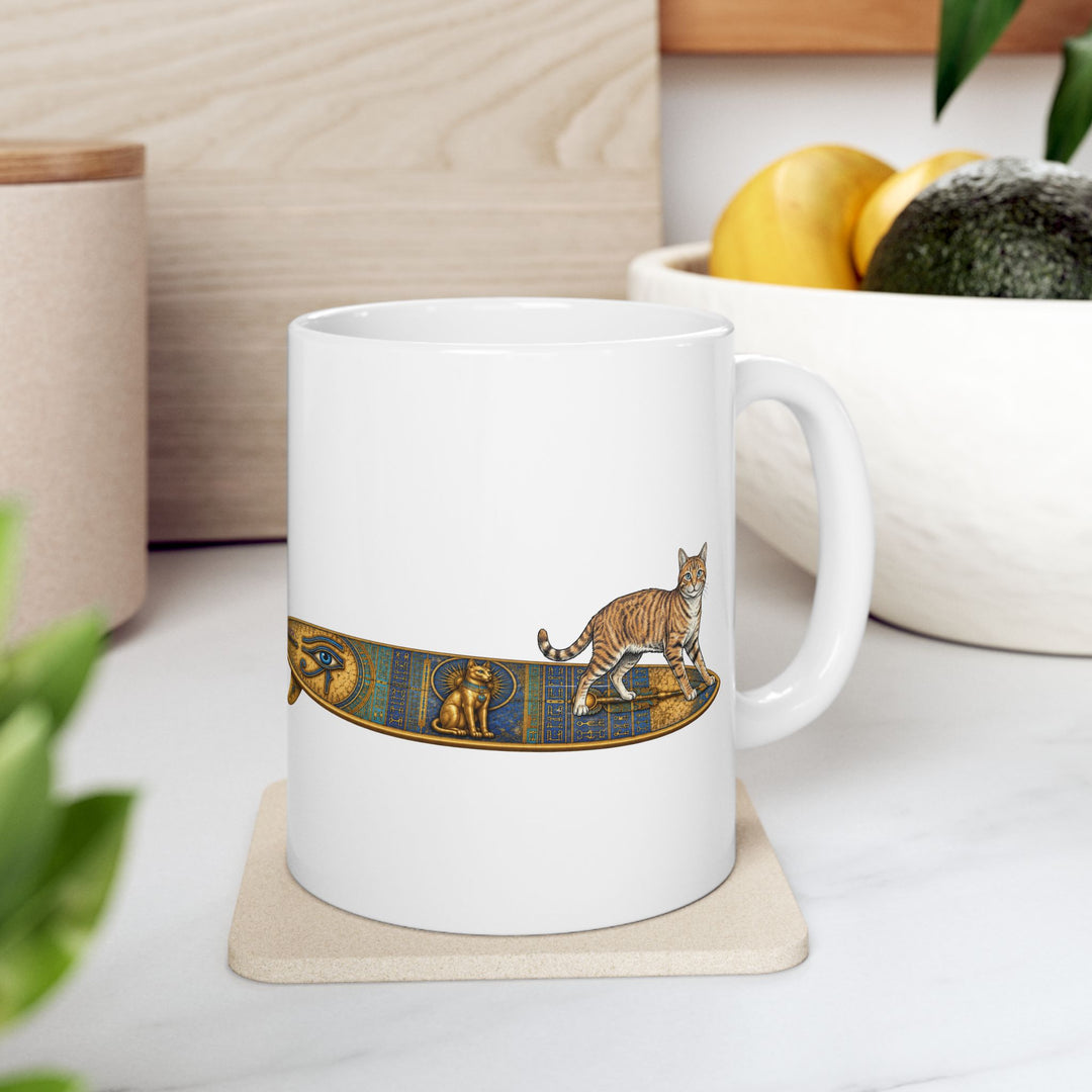 White mug featuring a Tabby Cat standing on a Egyptian surfboard on a coaster