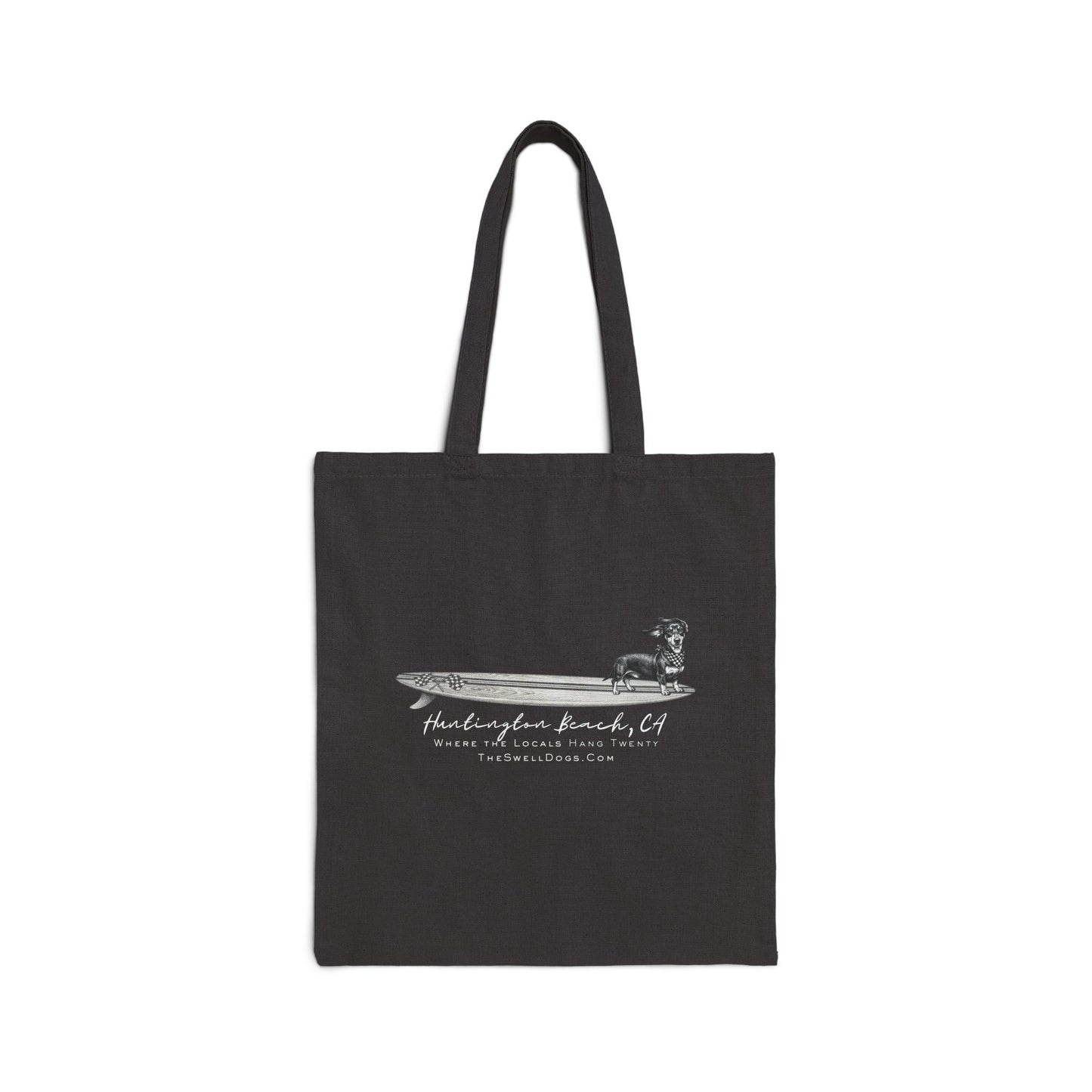 Black tote bag featuring a Dachshund dog standing on a surfboard with "Huntington Beach, CA" text