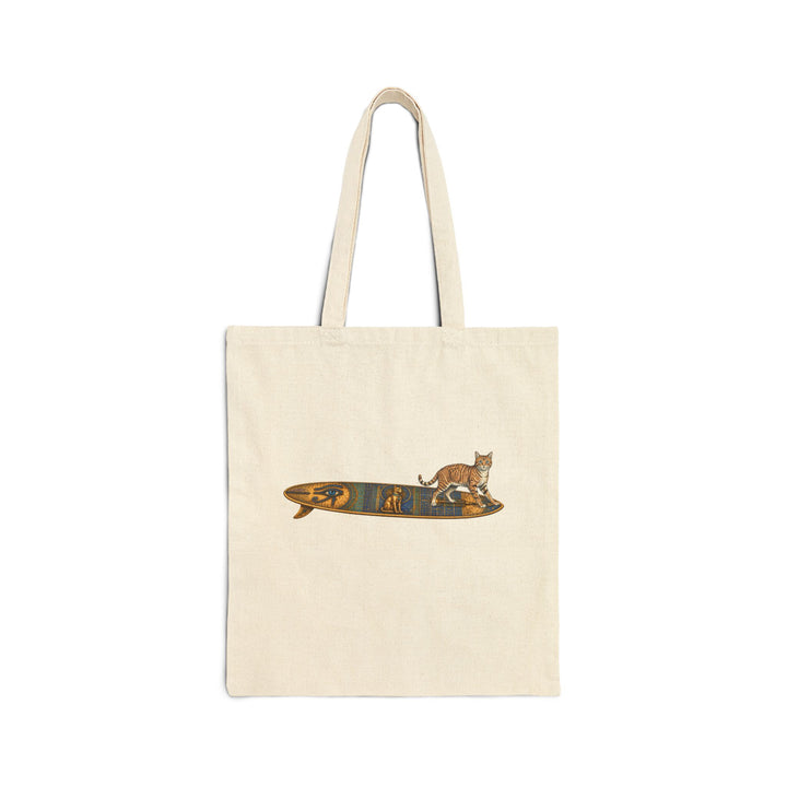 Beige tote bag featuring a tabby cat standing on an Egyptian surfboard