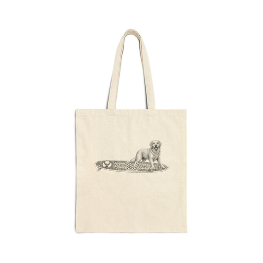 Beige tote bag with a white Golden Retriever dog on a surfboard with a irish knot graphic on it.