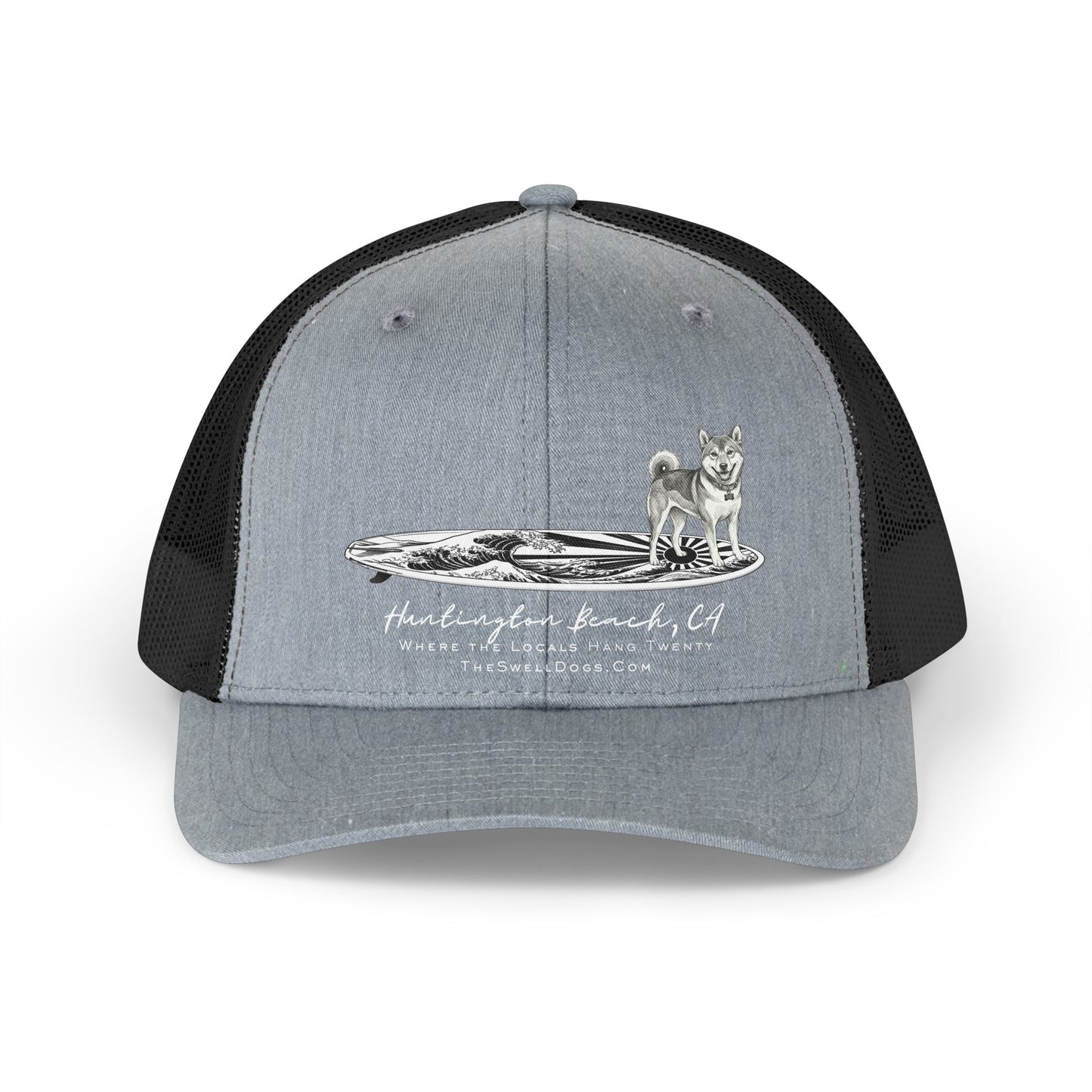Grey trucker hat featuring a Shiba Inu dog standing on a Japanese surfboard with "Huntington Beach, CA" text