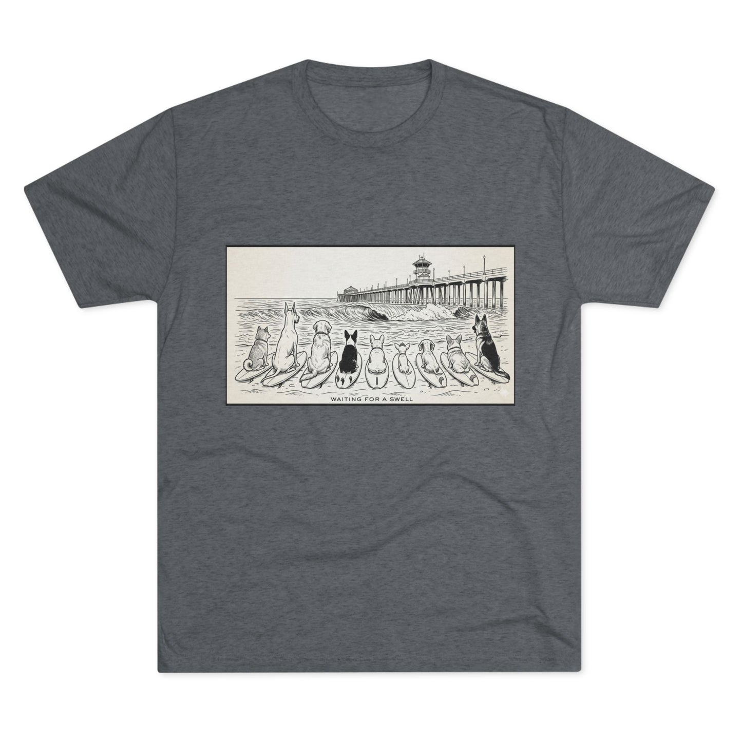 Gray tshirt with a pack of dogs on surfboards staring out to sea, with the words Waiting for a Swell' underneaath the dogs and the Huntington Beach pier in the background.