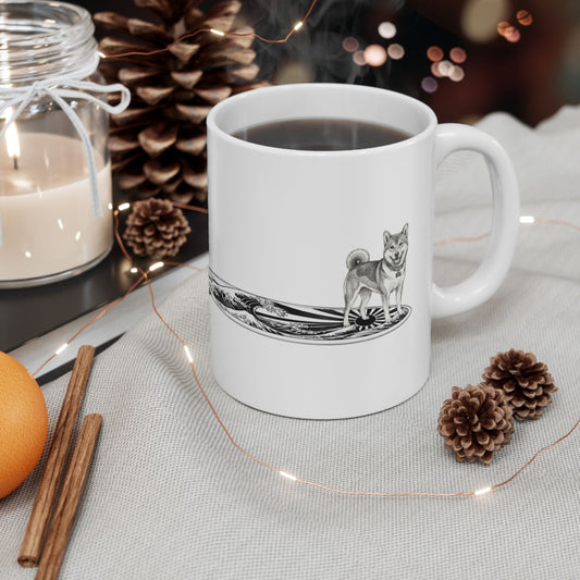 White mug with a Shiba Inu dog on a surfboard with a graphic of a Japanese wave and sun flag on it.