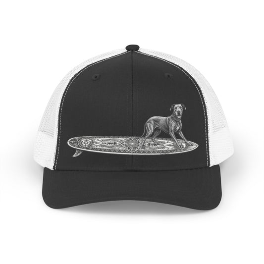 Black and white trucker hat with a Great Dane on a celtic knoit surfboard.  with a dog on a surfboard design on a white background
