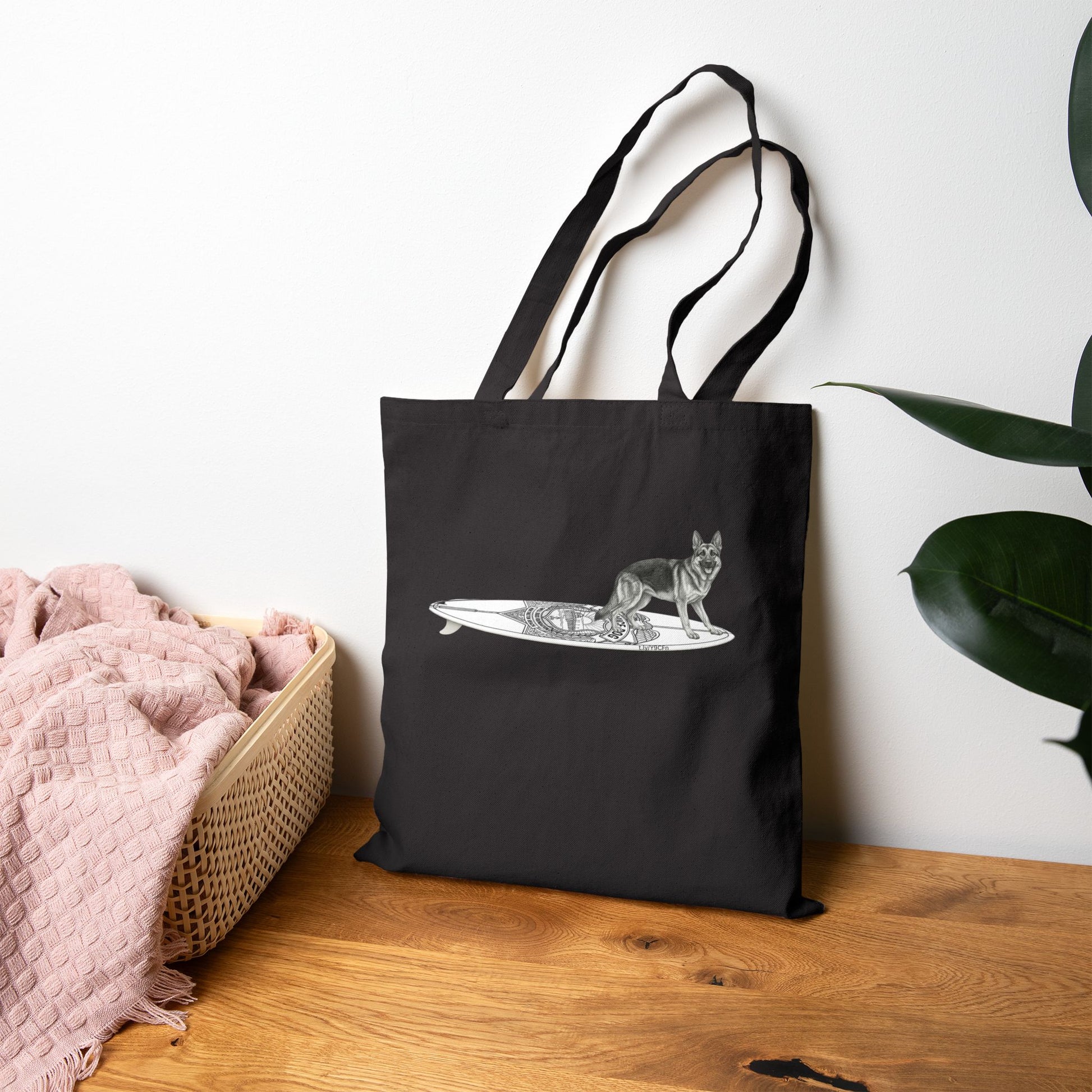 Black  tote bag with a German Shepherd dog on a service dog long surfboard.