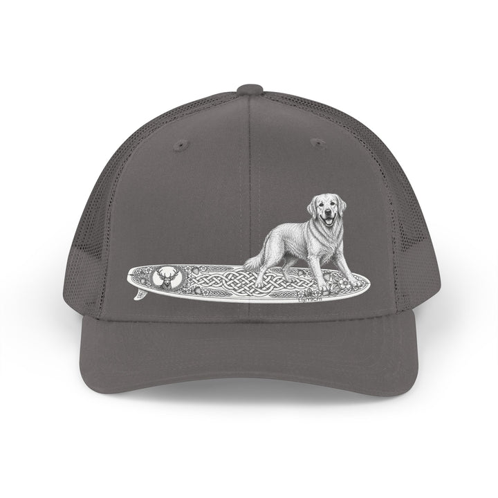 Gray trucker hat with a Golden Retriever riding a long surfboard with keltic knots and embellishments.cap with a dog on a surfboard design.