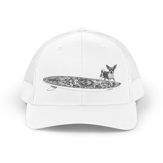 White trucker hat with a Chihuahua surfing on a Day of the Dead surfboard. 