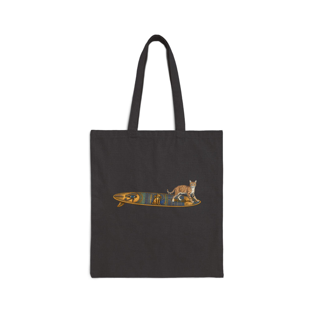 Black tote bag featuring a tabby cat standing on an Egyptian surfboard