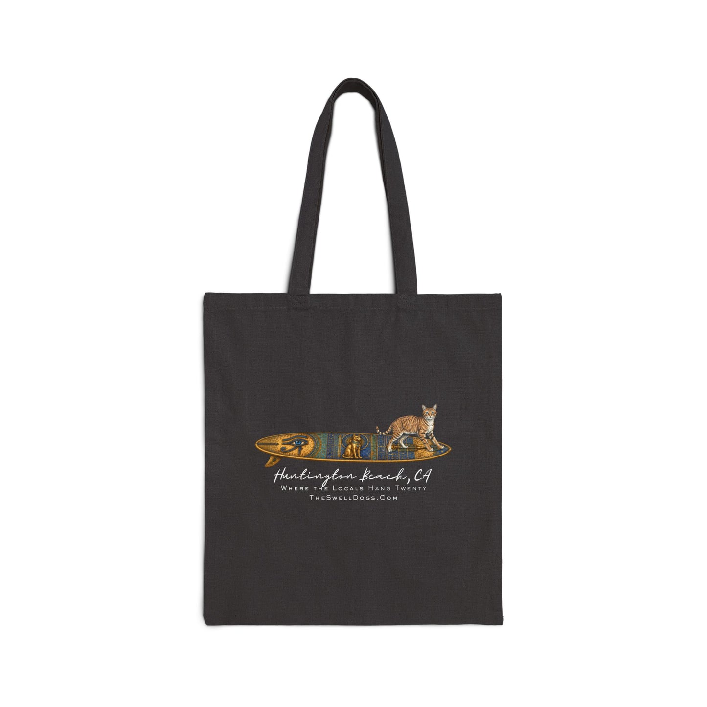 Black tote bag featuring a tabby cat standing on an Egyptian surfboard with "Huntington Beach, CA" text