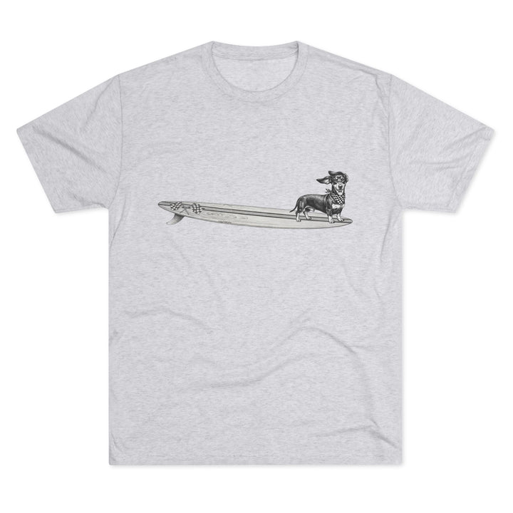 Light heather grey t-shirt with vintage Dachshund wearing checkered racing flag bandana on a wood grain racing flag surfboard — The Swell Dogs