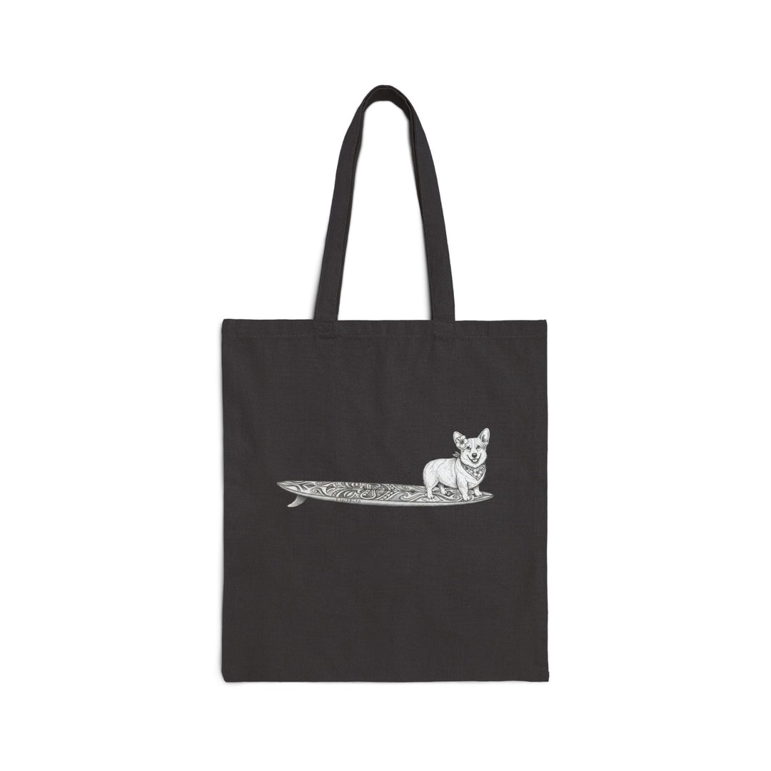 Black canvas tote bag with vintage Corgi wearing hibiscus bandana and hibiscus in her ear on a tiki surfboard line drawing — The Swell Dogs